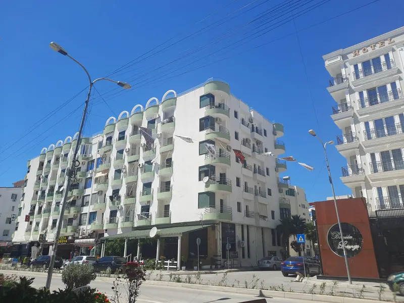 The apartment building on a sunny street in Golem